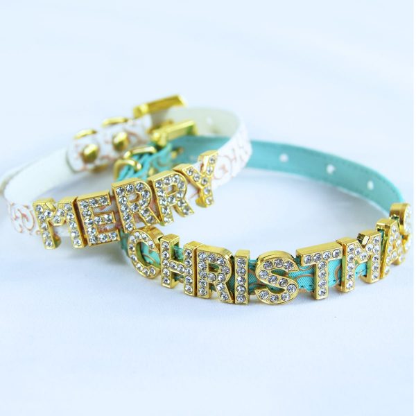 Two cat collars with the words MERRY CHRISTMAS